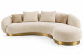 Sofá curvo tapizado de contorno redondeado, beige y dorado